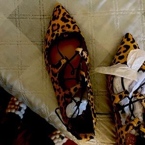 Cheetah print flats with ties up the ankle or leg